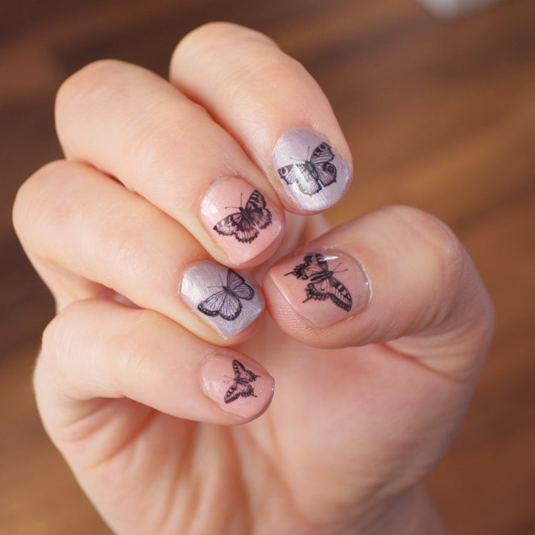 Set of 16 Butterfly nail decal transfers.
