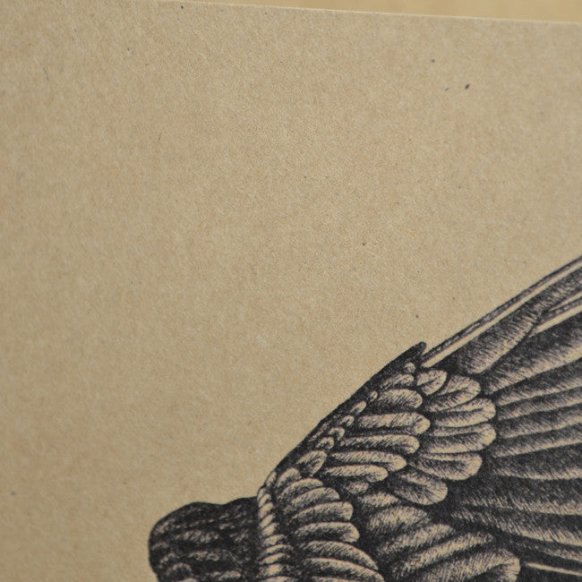 Recycled A6 notebook with raven illustration.