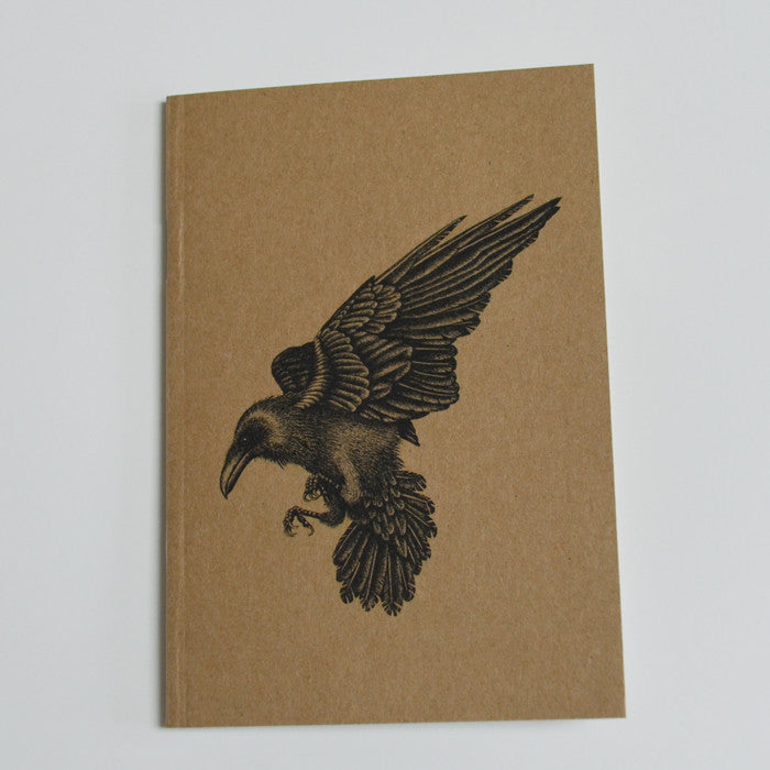 Recycled A6 notebook with raven illustration.
