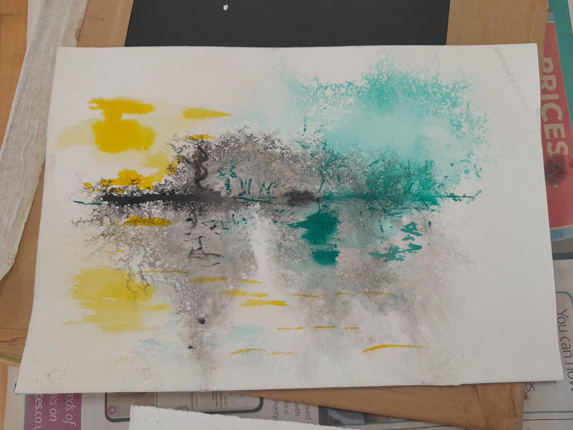 Abstract art piece with splashes of yellow, blue, and gray on a white background.