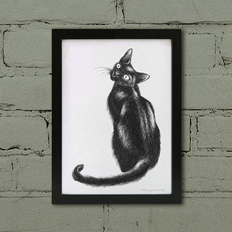 Black cat art print in frame.